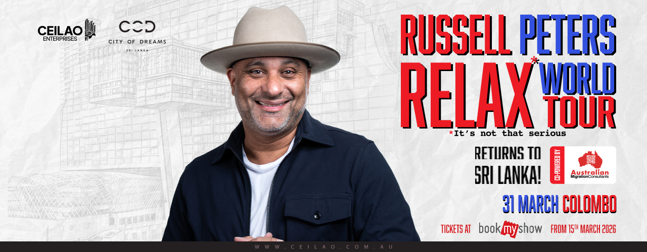 Russell Peters performing on stage
