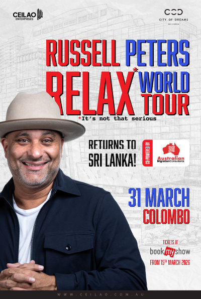 Russell Peters performing on stage